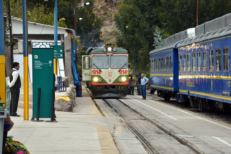 Train services to Machu Picchu, on the left Incarail and on the right Perurail Contemplating Machu Picchu