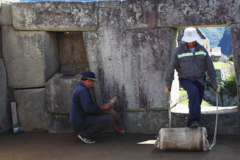 Staff doing restorations in the Machu Picchu grounds