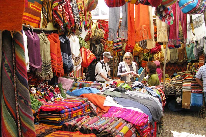 Tourists shopping at Pisac market