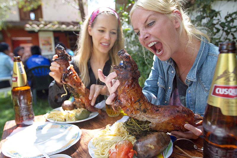 Visitors trying the popular Baked Guinea Pig