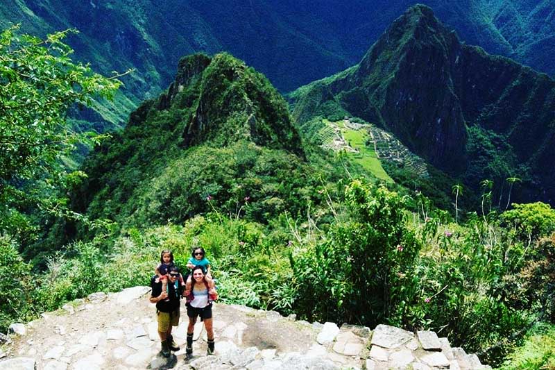 Tourists climbing Machu Picchu mountain