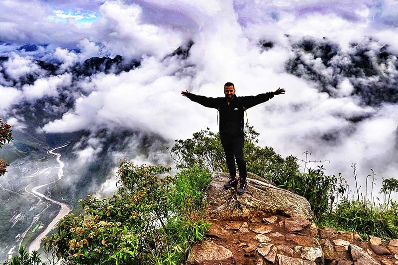 Machu Picchu mountain top among the clouds