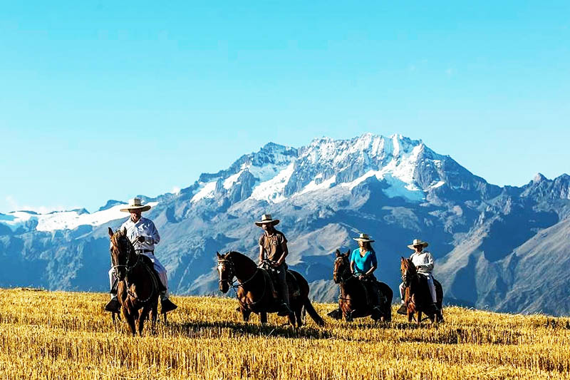 Horseback Riding through the Sacred Valley Tourists riding in the Sacred Valley