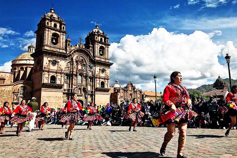Typical dances of Cusco Women presenting pitic dances in the main square of Cusco