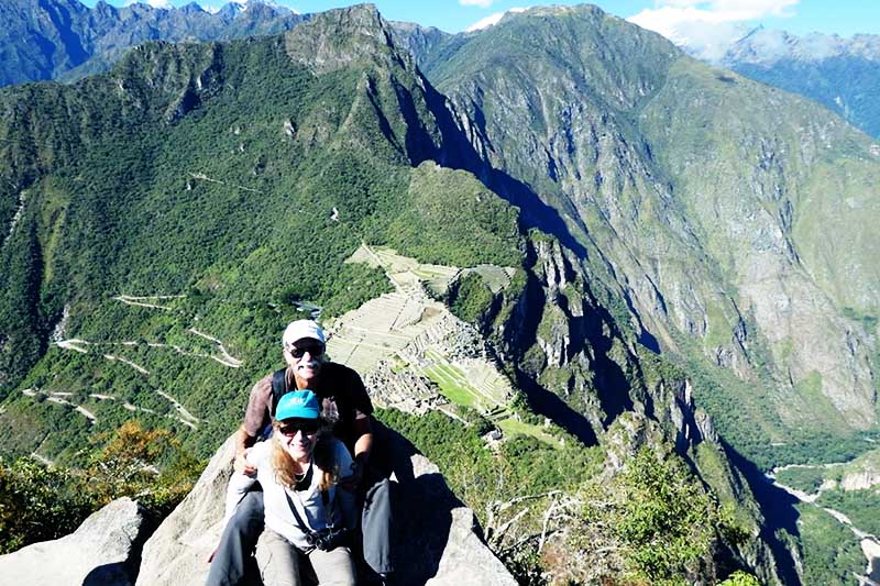 Older adults at the top of Huayna Picchu mountain