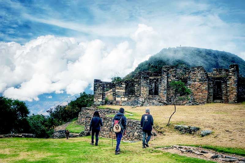 Tourists touring Choquequirao Tourists entering Choquequirao