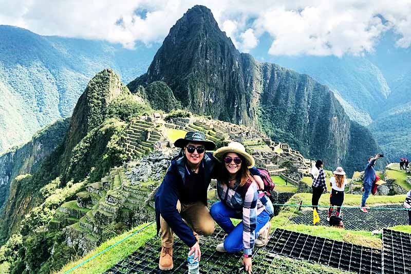 Machu Picchu with tourists Machu Picchu