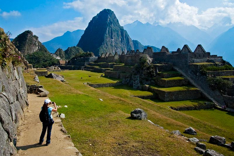Turita taking picture in Machu Picchu at the bottom of the picture