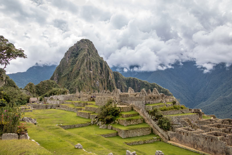 Machu Picchu ruins and Huayna Picchu Mountain in the background