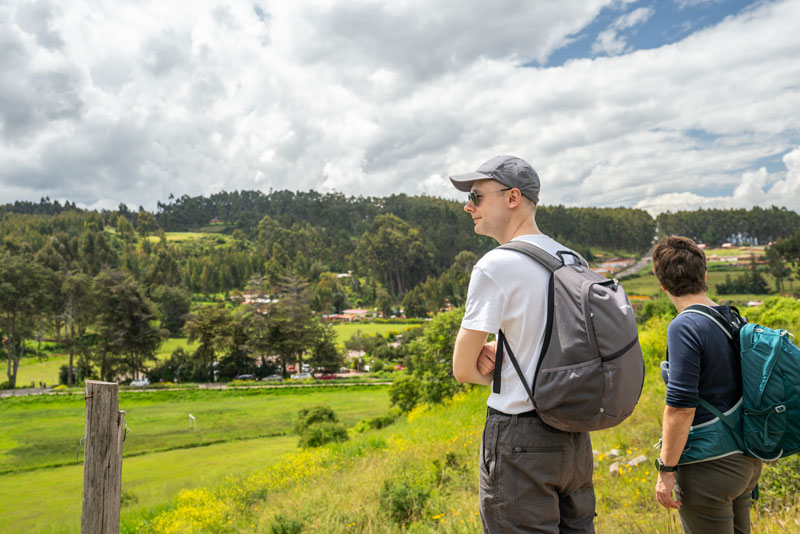 Tourist observing the landscape on his walk